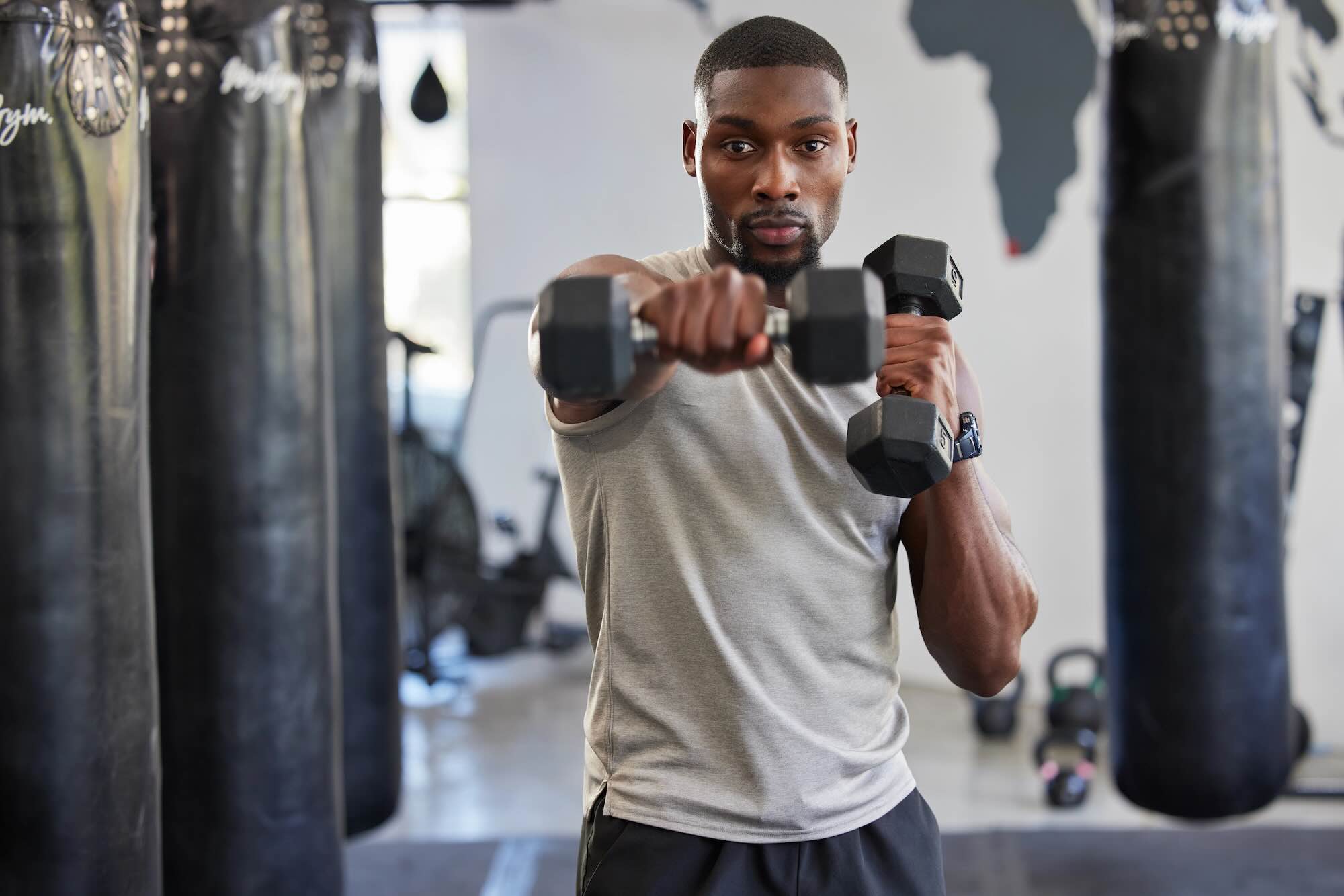 Patient working out with a torn bicep tendon, prioritizing his healing while staying active