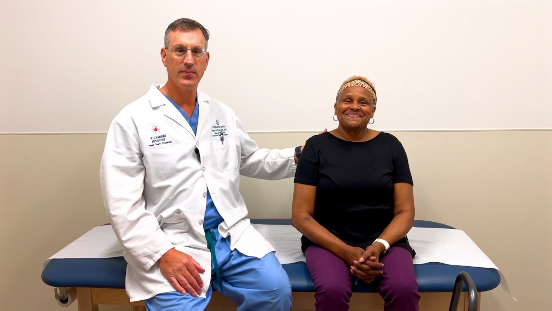 Dr. Paul Kiritsis with a patient in the exam room