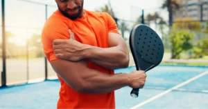 man experiencing shoulder pain from a sports shoulder injury.