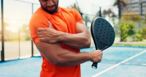man experiencing shoulder pain from a sport